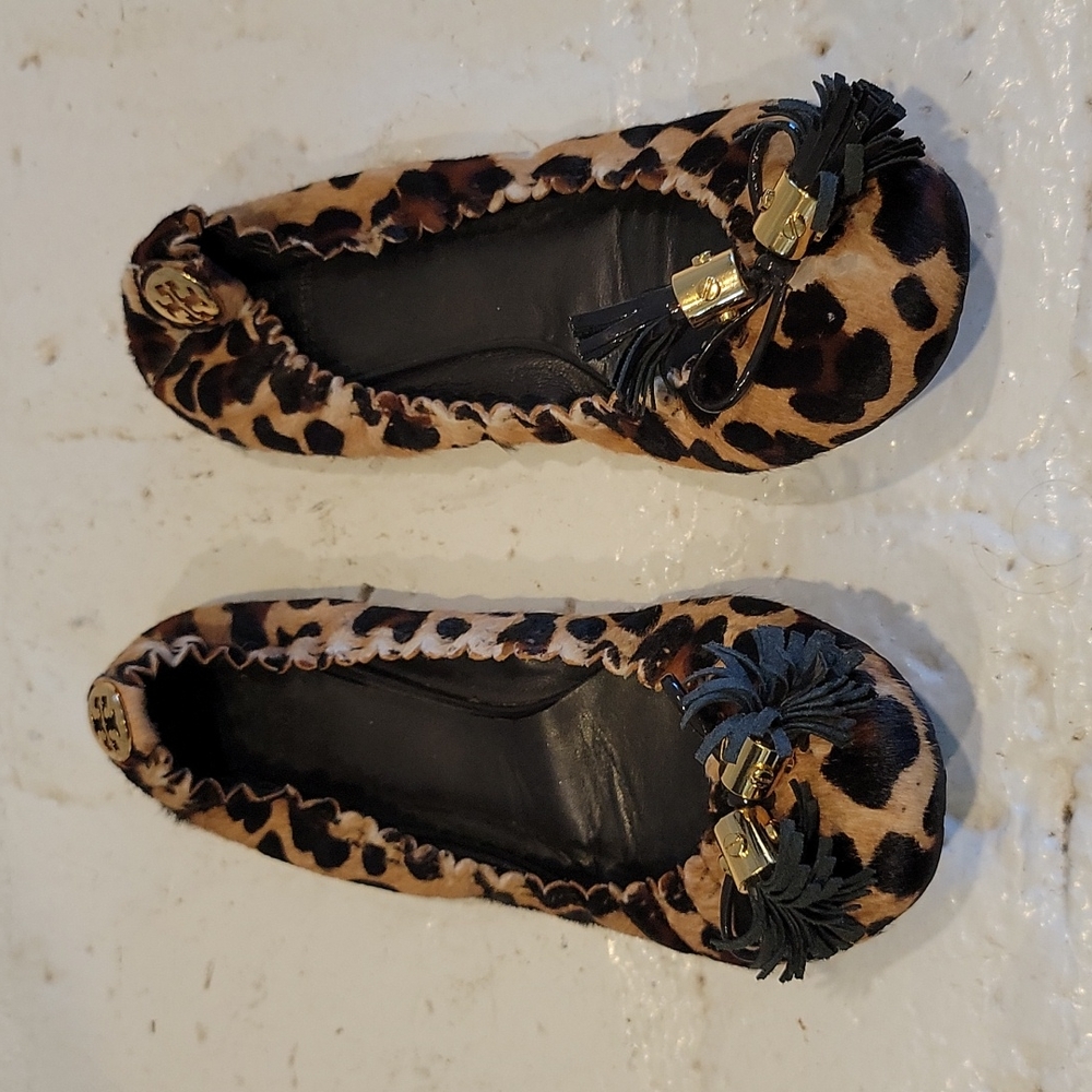 Tory Burch Reese Leather Ballet Flats Leopard Print w/ gold metal and tassles.